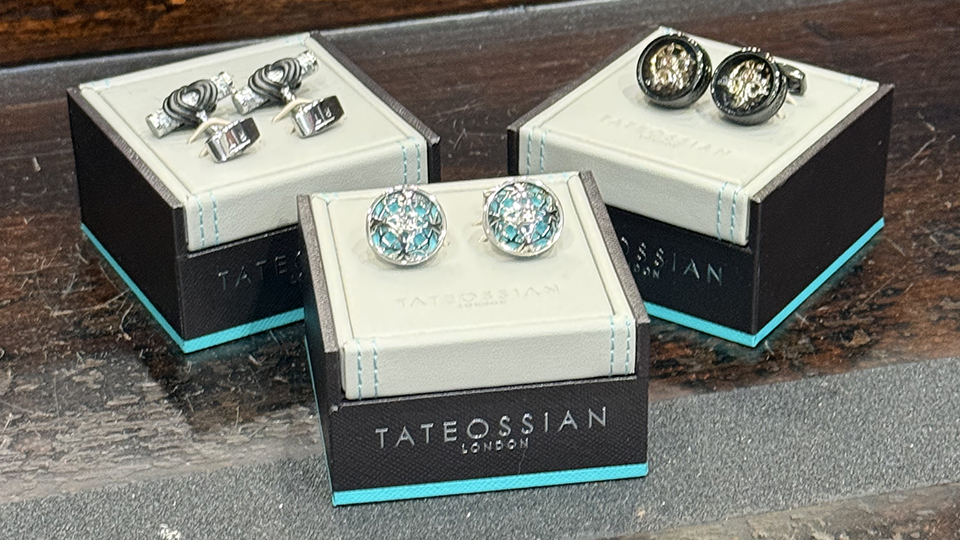 3 sets of handcrafted cufflinks displayed on boxes glistening.