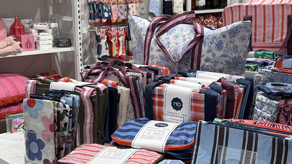 Colourful patterned bags, pouches and home accessories displayed inside Stanley & Stone in Camberwell Junction.