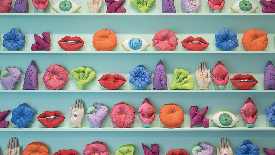 Photo of wall full of quirky sewn plushies as an installation for Wall of Magic Creatures by Kate Beynon at the Hawthorn Arts Centre