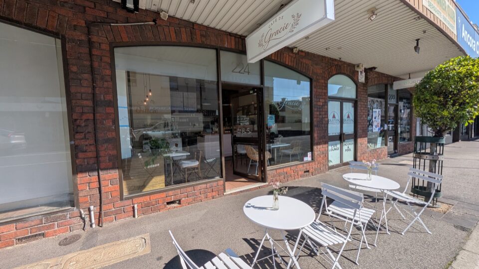 Cafe de Gracie storefront with outdoor seating