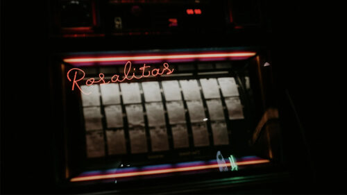 Photo of jukebox with Rosalita's in neon on the juke box.