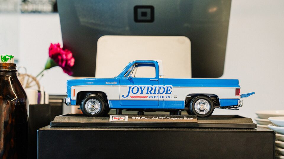 Model car with Joyride Coffee Co. logo on the side panel